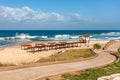 Promenade and empty beach on Mediterranean sea.