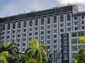 Promenade hotel building during sunny day.