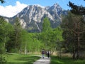 Promenade with people walking in mountain landscape at spring