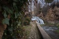 A waterfall of the Cifuentes river when it passes through the village center of Trillo, Guadalajara, Spain. Royalty Free Stock Photo