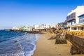 Promenade of scenic Playa Blanca with seaside in the morning