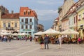 Promenade on Sfatului Place at Brasov, in Romania. Royalty Free Stock Photo