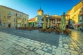 Promenade with street cafe at sunrise in Trogir, Dalmatia, Croatia Royalty Free Stock Photo