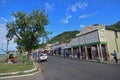 Promenade waterfront with local Fijian chatting and row of shops at Levuka, Ovalau island, Fiji Royalty Free Stock Photo