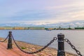 Promenade of Zayachy Hare Island with Fencing chain posts, Neva river, Cityscape of Saint Petersburg