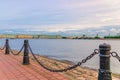 Promenade of Zayachy Hare Island with Fencing chain posts, Neva river, Cityscape of Saint Petersburg