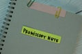 Promissory Note write on sticky notes isolated on Wooden Table