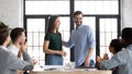 Promoted female employee receive congrats from company staff