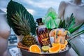 Promotional photography rum ice bowl palm leaves pineapple orange