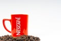 Promotional red Nescafe mug on white background