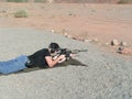 Prone man at outdoor shooting range Royalty Free Stock Photo