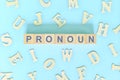 Pronoun concept in English grammar and learning class lesson. Wooden blocks typography