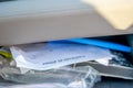 Proof of insurance and vehicle registration documents in the glove compartment of a car. Royalty Free Stock Photo