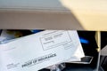 Proof of insurance and vehicle registration documents in the glove compartment of a car. Royalty Free Stock Photo