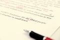 Proofreading of English sentences on white paperwork Royalty Free Stock Photo