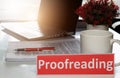 Proofreading paper on white table