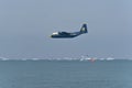 Prop plane C-130J Super Hercules flying over the sea at Chicago air show in the USA Royalty Free Stock Photo