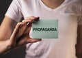 Propaganda word on paper. Manipulation and brainwash campaign by media concept Royalty Free Stock Photo