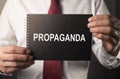 Propaganda word on paper. Manipulation and brainwash campaign by media concept Royalty Free Stock Photo