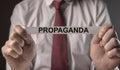 Propaganda word on paper. Manipulation, deception and misinformation by media and government concept