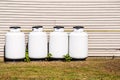 Propane Cylinders along the back external wall of a house