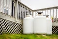 Propane Cylinders in a Garden on a Cloudy Day