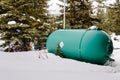 Propane Tank ina Bckyard Covered in Snow