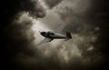 Propeller airplane with dark clouds