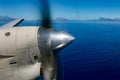 Propeller airplane detail flying in tropical paradise