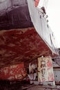 Propeller of cargo ship. Dry dock. View from stern. Rusty. Before repeating work Royalty Free Stock Photo