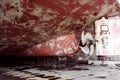 Propeller of cargo ship. Dry dock. View from stern. Rusty. Before repeating work