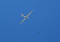 Propeller-driven airplane is towing a glider Royalty Free Stock Photo