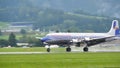 Propeller four-engine airliner from the 1950s landing Royalty Free Stock Photo