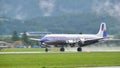 Propeller four-engine airliner from the 1950s landing Royalty Free Stock Photo