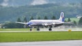 Propeller four-engine airliner from the 1950s landing Royalty Free Stock Photo