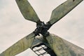 Propeller from a helicopter close-up on a background of gray sky. Color toning