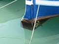 Propeller and keel of a blue wooden fishing boat moored in the harbor . Livorno, Tuscany, Italy Royalty Free Stock Photo