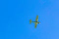 Propeller plane Aeronautics flies in the blue sky with clouds Mexico