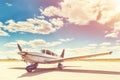 Propeller plane parking at the airport. Royalty Free Stock Photo