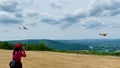 Propeller plane towing glider with a rope, at Harris Hill soaring site