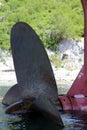 A propeller from a ship stuck on the seashore on a hot summer sunny day. Royalty Free Stock Photo