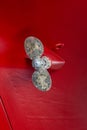 Propeller at the Stern of a Hull on a Red Yacht