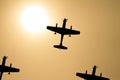 Propellor fighter Airplane silhouettes and sun Royalty Free Stock Photo