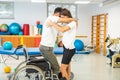 Proper lifting technique from a wheelchair Royalty Free Stock Photo