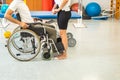 Proper lifting technique from a wheelchair Royalty Free Stock Photo