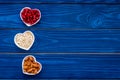 Proper nutrition for pathients with heart disease. Cholesterol reduce diet. Oatmeal, pomegranate, almond in heart shaped Royalty Free Stock Photo