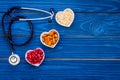 Proper nutrition for pathients with heart disease. Cholesterol reduce diet. Oatmeal, pomegranate, almond in heart shaped Royalty Free Stock Photo