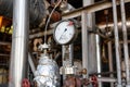 Properly working pressure gauge installed on the pipeline at the old chemical plant Royalty Free Stock Photo