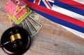 Property auction, flag Hawaii, gavel wooden and model house on wooden background, lawyer of home real estate