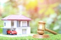 Property auction, Gavel wooden and model house on natural green background, lawyer of home real estate and ownership property